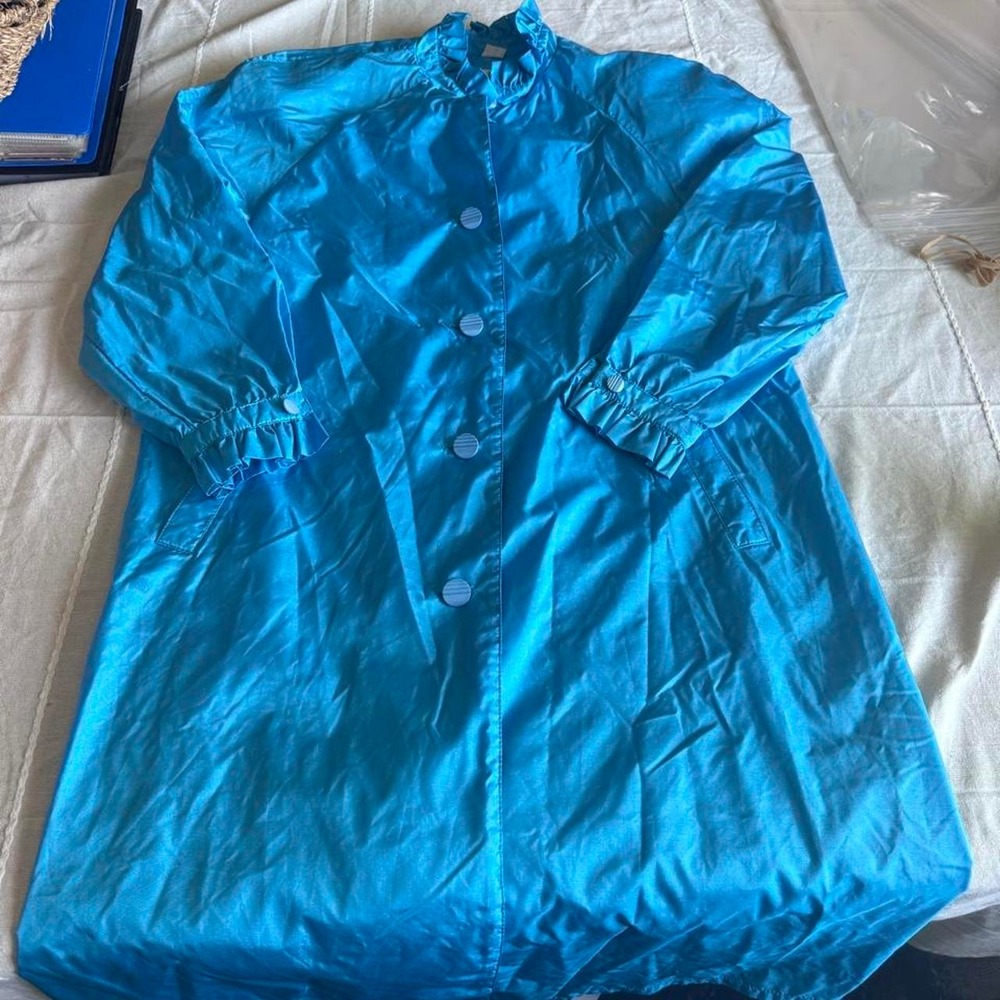 Blue raincoat with button-up front and elastic cuffs, size 12P